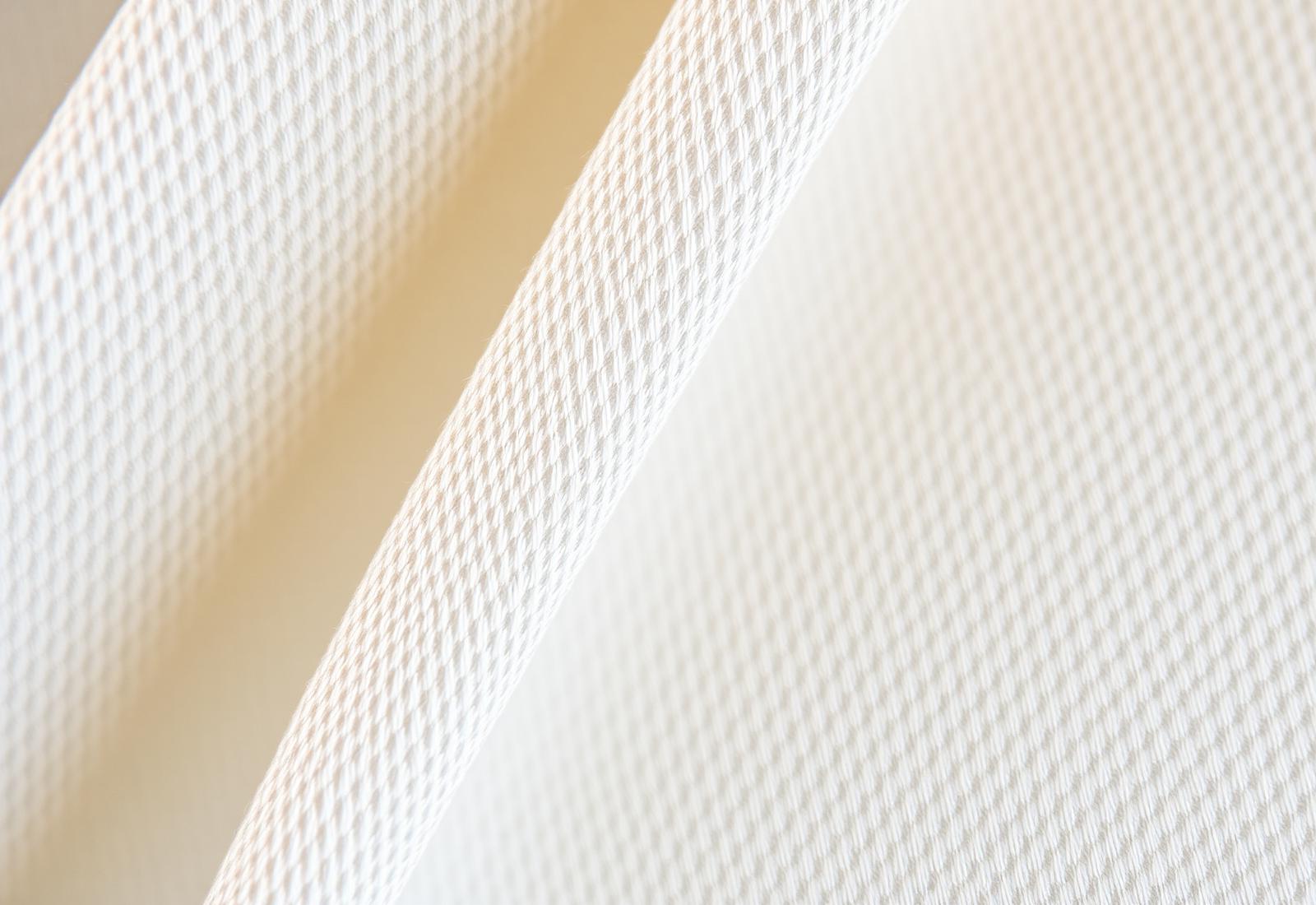 Macro detail of woven fabric construction used for garment manufacturing