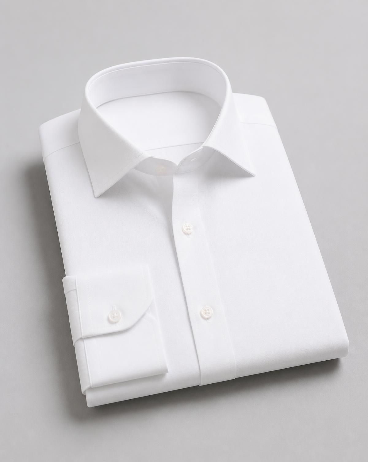 Folded plain white woven formal shirt manufactured by Sreevari Apparels