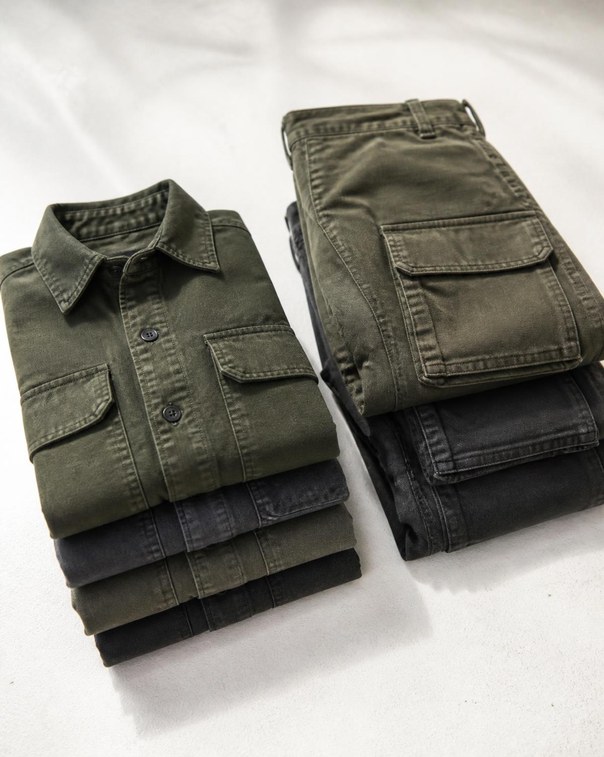 Folded olive workwear overshirts and cargo trousers
